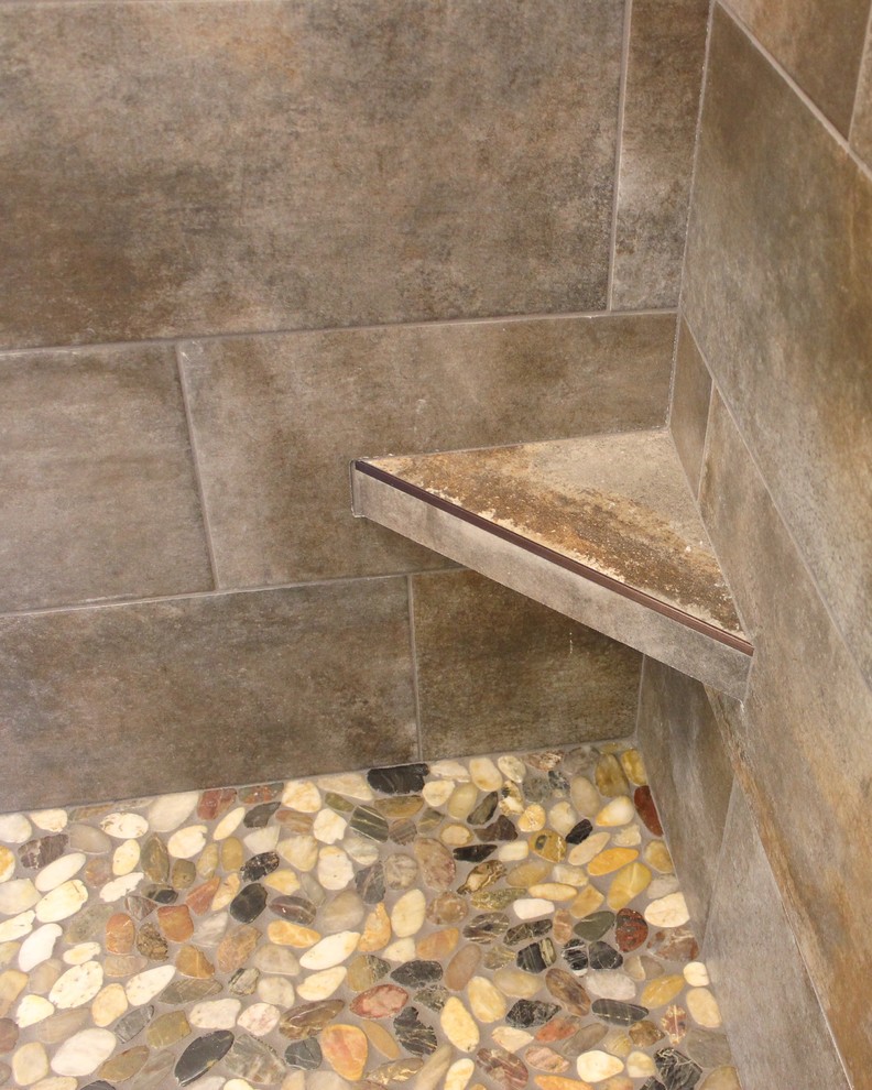 Mid-sized transitional master brown tile and stone tile ceramic tile and brown floor double shower photo in Wilmington with flat-panel cabinets, gray cabinets, an undermount sink, granite countertops and a hinged shower door