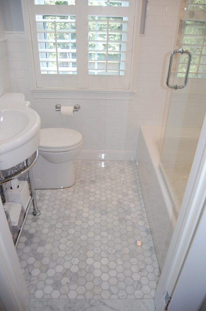 Photo of a medium sized traditional ensuite bathroom in Baltimore with open cabinets, an alcove bath, a shower/bath combination, a one-piece toilet, white tiles, ceramic tiles, blue walls, ceramic flooring, a console sink, multi-coloured floors and an open shower.