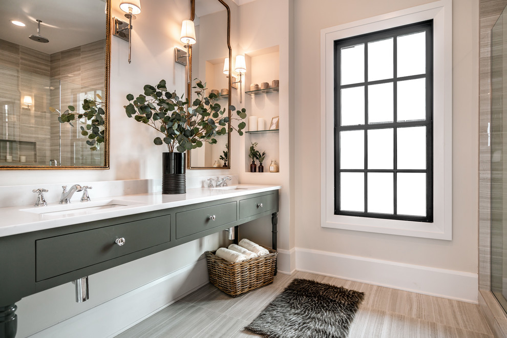 This is an example of a traditional ensuite bathroom in Louisville with grey cabinets, grey tiles, grey walls, a submerged sink, grey floors, white worktops and flat-panel cabinets.