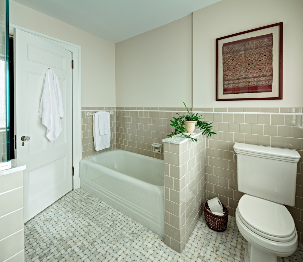 Classic half tiled bathroom in New York with an alcove bath.