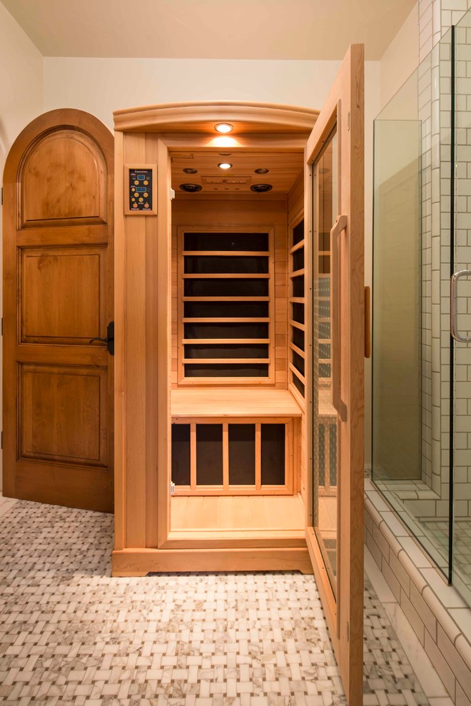 Example of a large tuscan master subway tile mosaic tile floor doorless shower design in Santa Barbara with recessed-panel cabinets, medium tone wood cabinets, a two-piece toilet, white walls and a drop-in sink