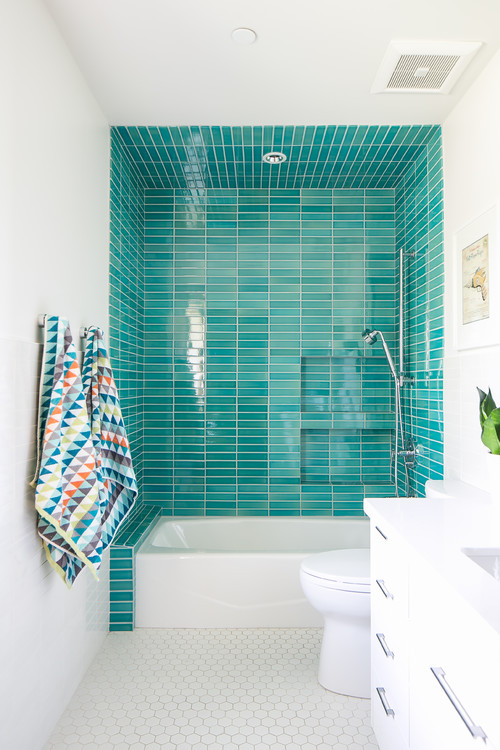 Teal Waterside Beauty: Glass Teal Tiles with Built-in Niche and White Hex Floor Tiles for Beach Bathroom Ideas