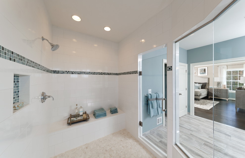 Design ideas for a large traditional ensuite wet room bathroom in DC Metro with shaker cabinets, black cabinets, a built-in bath, blue tiles, white tiles, porcelain tiles, blue walls, porcelain flooring, an integrated sink and engineered stone worktops.