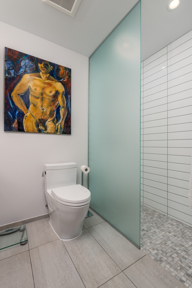 Walk-in shower - small contemporary master white tile and ceramic tile ceramic tile walk-in shower idea in Montreal with flat-panel cabinets, medium tone wood cabinets, a one-piece toilet, white walls, an undermount sink and quartz countertops