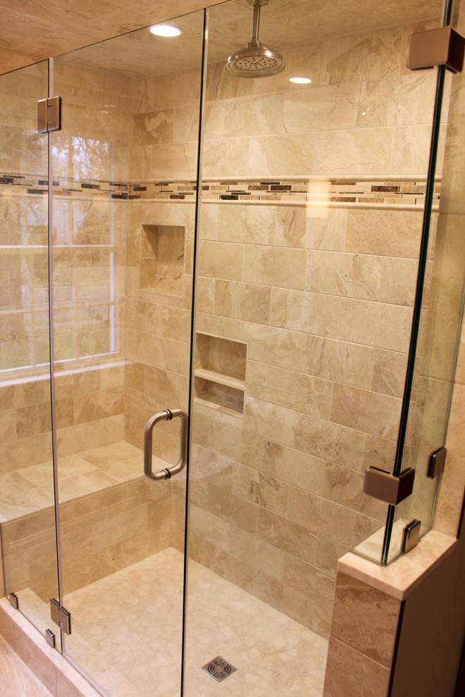 Photo of a medium sized ensuite bathroom in Philadelphia with a submerged sink, recessed-panel cabinets, medium wood cabinets, granite worktops, an alcove shower, beige tiles, stone tiles and travertine flooring.