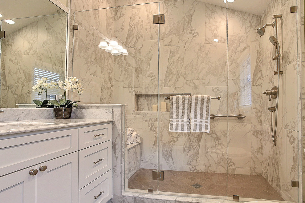 Example of a mid-sized trendy master brown tile ceramic tile double shower design in San Francisco with an undermount sink, recessed-panel cabinets, white cabinets, a one-piece toilet and green walls