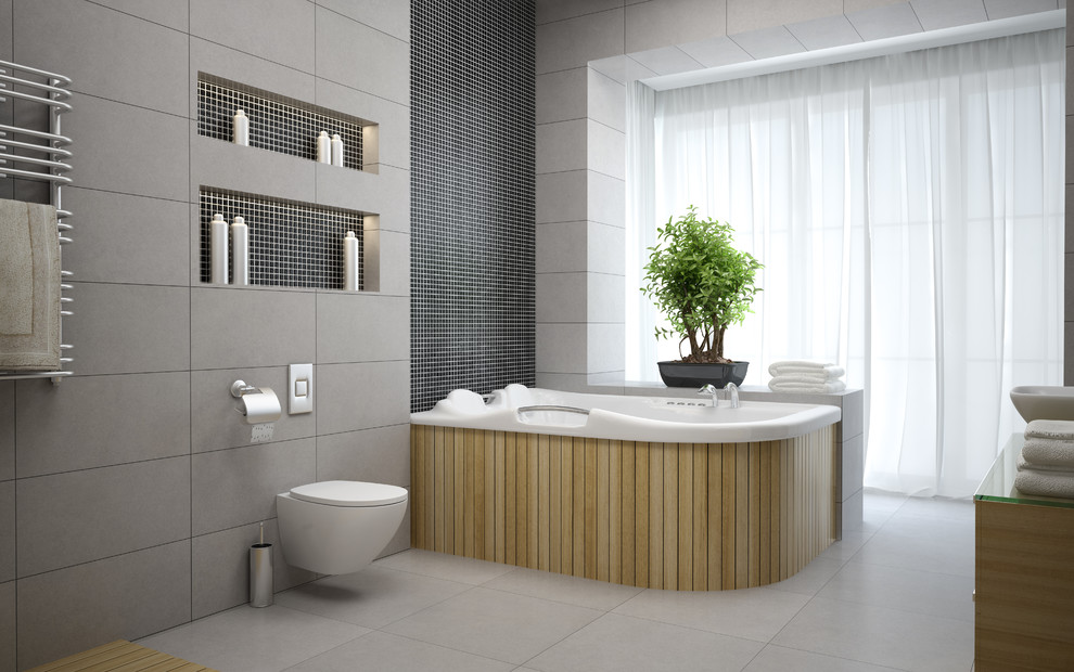 Réalisation d'un grand sauna minimaliste en bois clair avec un bain bouillonnant, WC suspendus, un carrelage gris, des carreaux de béton, un mur gris, un sol en carrelage de céramique, un sol gris, un placard à porte plane, un lavabo suspendu et un plan de toilette en verre.