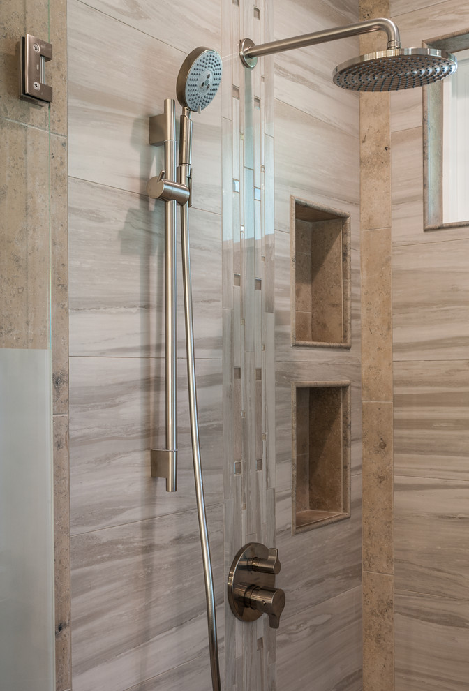Inspiration for a medium sized contemporary ensuite bathroom in San Francisco with flat-panel cabinets, dark wood cabinets, a double shower, a one-piece toilet, beige tiles, brown tiles, porcelain tiles, grey walls, porcelain flooring, a submerged sink and limestone worktops.