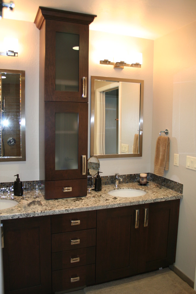 Mid-sized elegant master gray tile and stone tile travertine floor bathroom photo in San Francisco with an undermount sink, recessed-panel cabinets, dark wood cabinets, granite countertops and beige walls