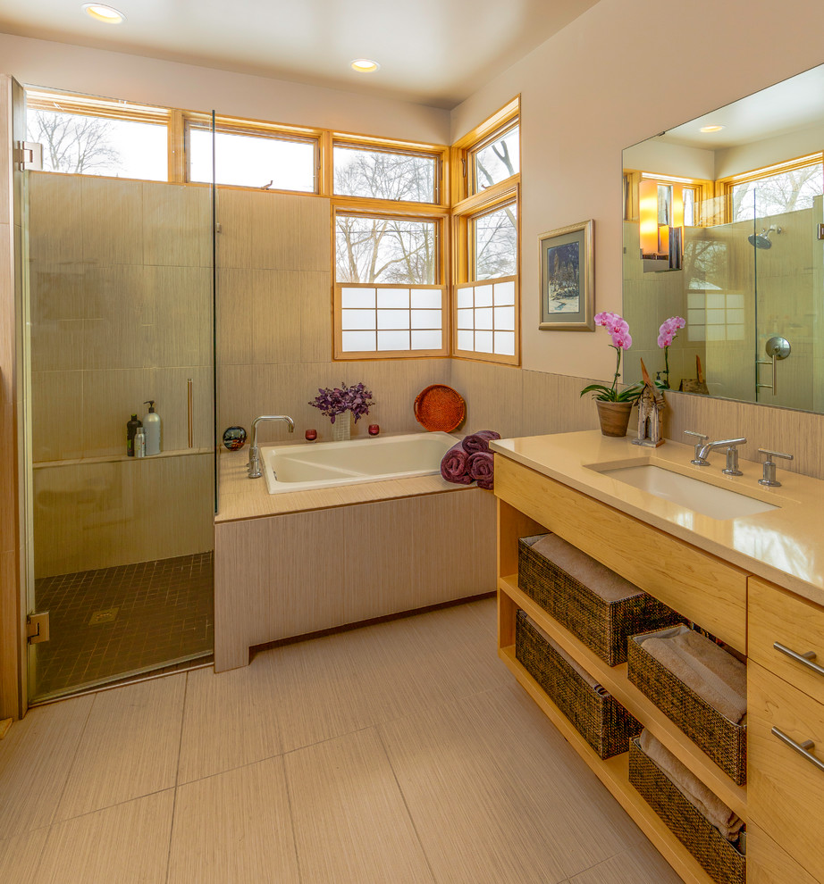 Medium sized world-inspired ensuite bathroom in Minneapolis with a submerged sink, open cabinets, medium wood cabinets, a built-in bath, a built-in shower, beige tiles, white walls, quartz worktops, porcelain tiles and porcelain flooring.