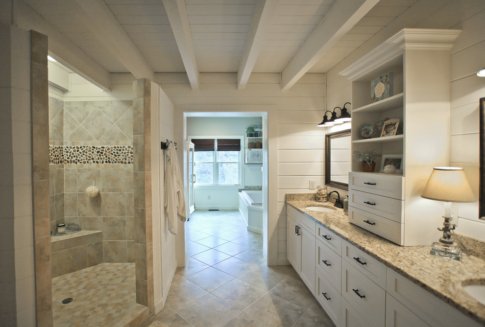 Example of a large arts and crafts master beige tile and porcelain tile porcelain tile bathroom design in Atlanta with shaker cabinets, white cabinets, a two-piece toilet, beige walls, an undermount sink and granite countertops