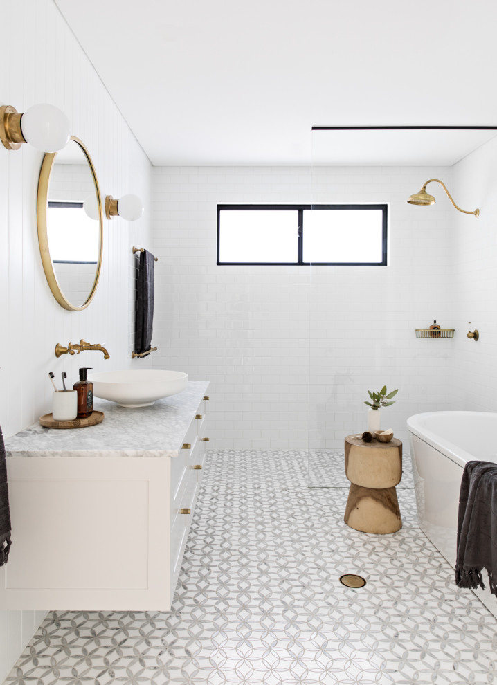Scandinavian bathroom in Sydney with shaker cabinets, white cabinets, a freestanding bath, a built-in shower, white tiles, metro tiles, white walls, mosaic tile flooring, a vessel sink, grey floors, an open shower and grey worktops.