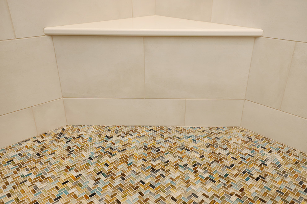 Inspiration for a mid-sized transitional master multicolored tile and mosaic tile cement tile floor and gray floor corner shower remodel in Grand Rapids with recessed-panel cabinets, light wood cabinets, blue walls, an undermount sink, quartz countertops and a hinged shower door