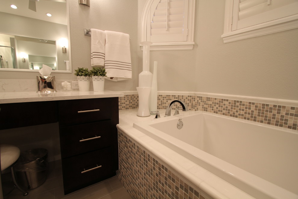 Example of a large transitional master porcelain tile drop-in bathtub design in Orlando with flat-panel cabinets, dark wood cabinets and gray walls