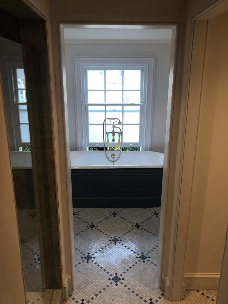 Victorian bathroom in London with marble flooring and white floors.