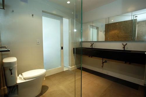 Inspiration for a large modern ensuite bathroom in San Francisco with limestone flooring and a trough sink.