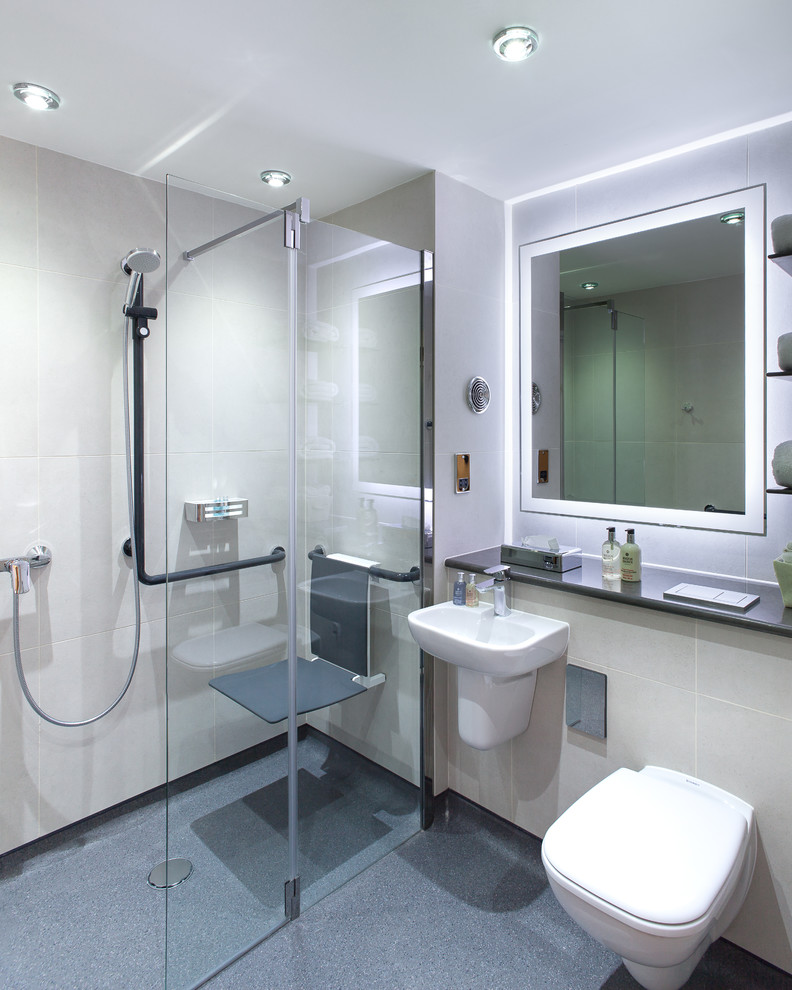 Photo of a medium sized contemporary shower room bathroom in London with a wall mounted toilet and a wall-mounted sink.