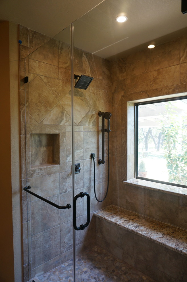 Inspiration for a mid-sized transitional master brown tile and porcelain tile porcelain tile double shower remodel in Austin with an undermount sink, raised-panel cabinets, brown cabinets, granite countertops, a two-piece toilet and beige walls