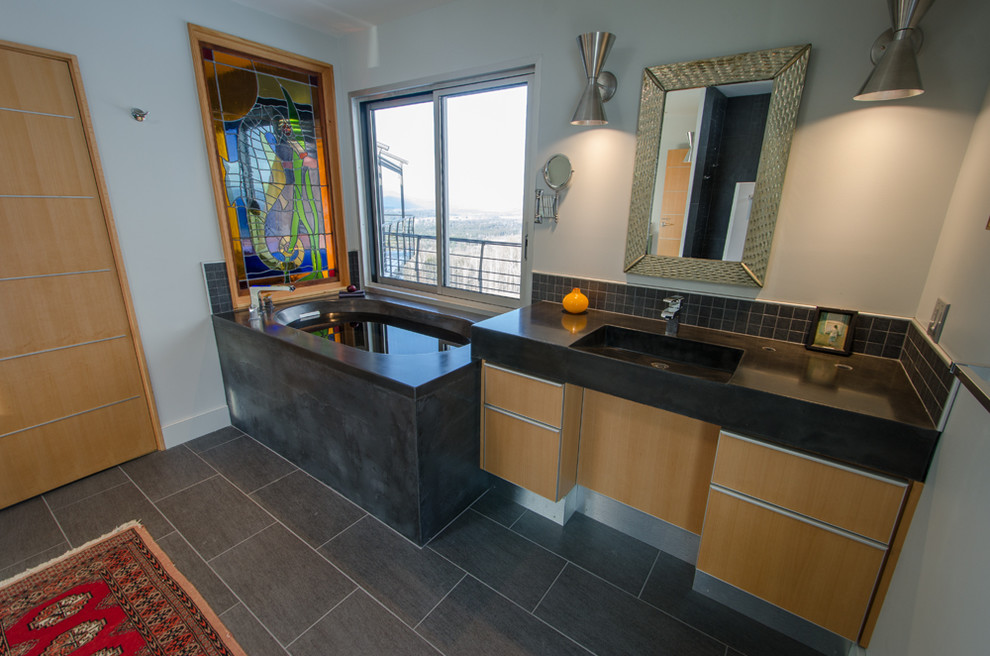 Example of a mid-sized eclectic master slate floor and gray floor bathroom design in Burlington with an integrated sink, flat-panel cabinets, concrete countertops, light wood cabinets and white walls