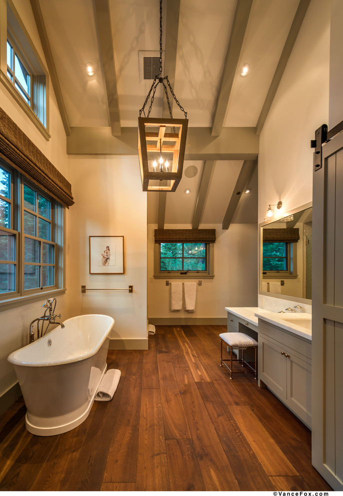 Inspiration for a large rustic ensuite bathroom in Sacramento with beaded cabinets, grey cabinets, a freestanding bath, white walls, medium hardwood flooring, a submerged sink and marble worktops.