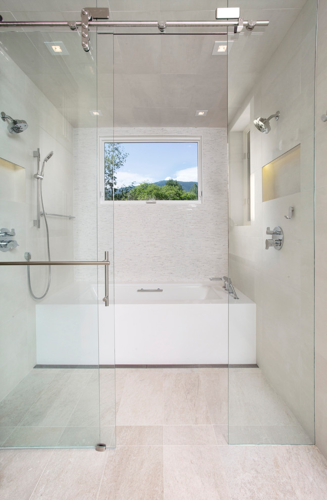 Photo of a large contemporary ensuite bathroom in Denver with an integrated sink, flat-panel cabinets, medium wood cabinets, solid surface worktops, a built-in shower, a two-piece toilet, white tiles, matchstick tiles, white walls and an alcove bath.