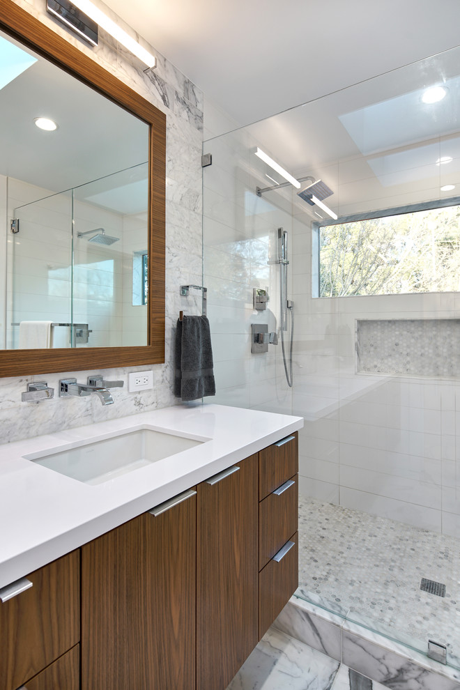 This is an example of a medium sized contemporary ensuite bathroom in San Francisco with brown cabinets, a one-piece toilet, black and white tiles, ceramic tiles, white walls, ceramic flooring, a submerged sink, granite worktops and white floors.