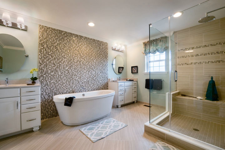 This is an example of a large contemporary ensuite bathroom in Philadelphia with recessed-panel cabinets, white cabinets, a freestanding bath, an alcove shower, mosaic tiles, blue walls, a submerged sink, porcelain flooring, brown floors and a hinged door.