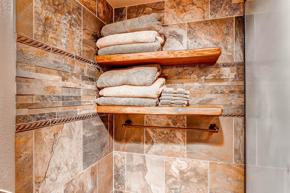 Double shower - large rustic master beige tile and ceramic tile ceramic tile double shower idea in Denver with a drop-in sink, raised-panel cabinets, medium tone wood cabinets, granite countertops, a two-piece toilet and brown walls