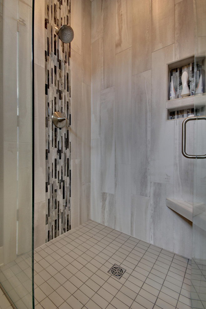 Inspiration for a mid-sized contemporary master gray tile porcelain tile and multicolored floor double shower remodel in Grand Rapids with flat-panel cabinets, medium tone wood cabinets, an undermount sink, quartz countertops and a hinged shower door
