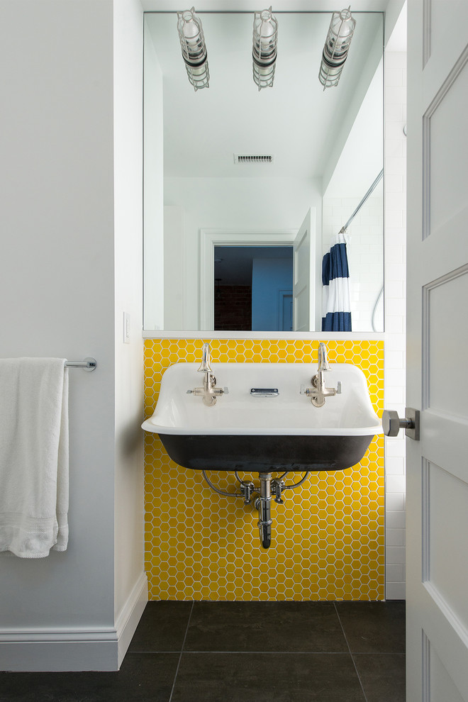 This is an example of a medium sized traditional family bathroom in DC Metro with open cabinets, an alcove bath, a shower/bath combination, yellow tiles, ceramic tiles, white walls, porcelain flooring, a trough sink, black floors and a shower curtain.