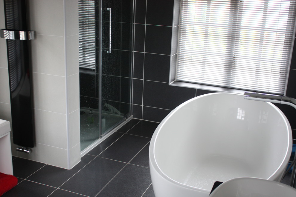 This is an example of a contemporary bathroom in Essex with a freestanding bath.