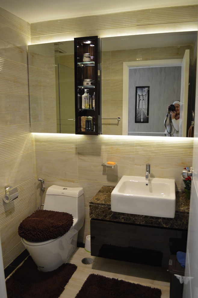 Small transitional 3/4 beige tile and porcelain tile porcelain tile corner shower photo in Other with dark wood cabinets, a one-piece toilet, beige walls and marble countertops