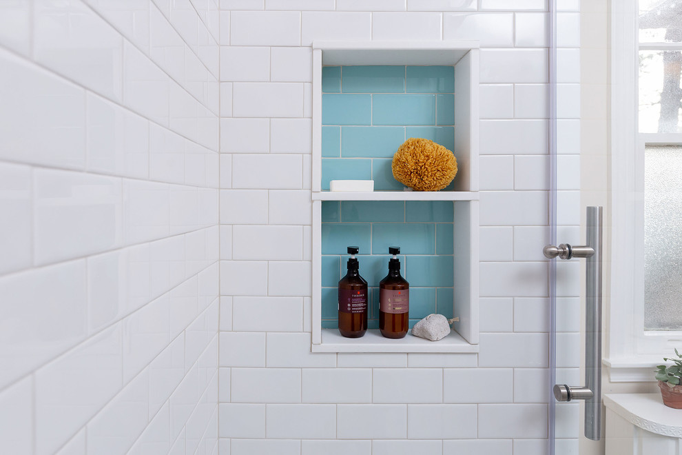Example of a small trendy 3/4 white tile and subway tile cement tile floor and multicolored floor bathroom design in Philadelphia with pink walls