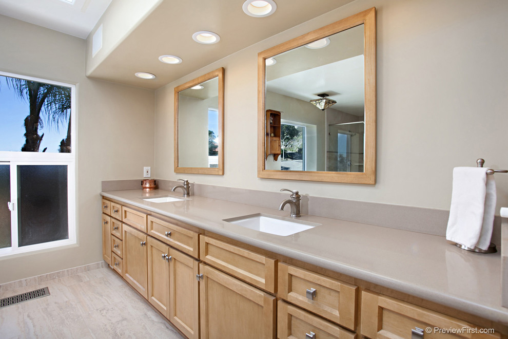 Photo of a large contemporary ensuite bathroom in San Diego with porcelain flooring, shaker cabinets, light wood cabinets, a built-in bath, a corner shower, a one-piece toilet, beige tiles, grey tiles, porcelain tiles, beige walls, a submerged sink and engineered stone worktops.