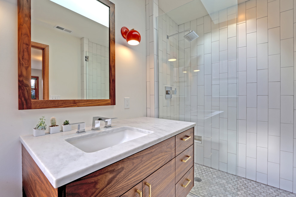 Mid-sized 1950s master white tile and subway tile marble floor and white floor bathroom photo in Portland with flat-panel cabinets, dark wood cabinets, a one-piece toilet, white walls, an undermount sink and marble countertops