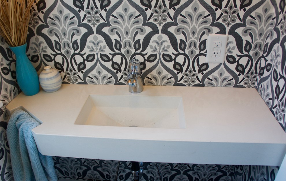 Example of a mid-sized 3/4 white tile and stone tile dark wood floor bathroom design in Philadelphia with a two-piece toilet, white walls, an integrated sink and quartz countertops