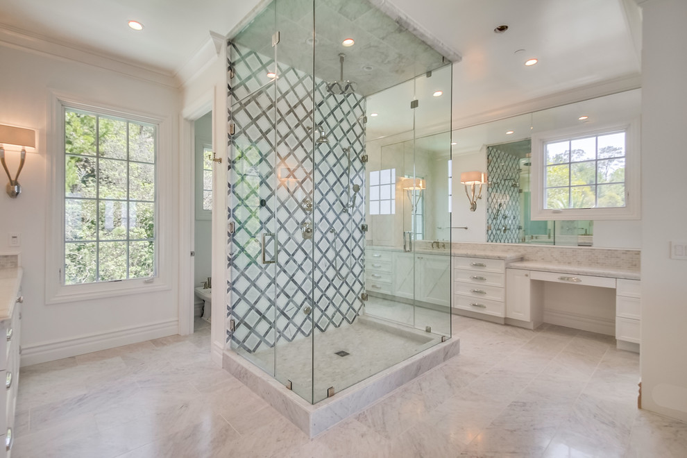 Expansive traditional ensuite bathroom in San Diego with shaker cabinets, white cabinets, an alcove bath, a corner shower, a one-piece toilet, white tiles, metro tiles, white walls, marble flooring, a submerged sink, marble worktops and white floors.