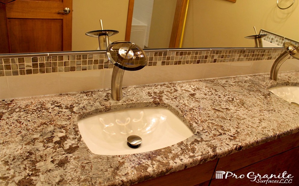 Trendy multicolored tile bathroom photo in Seattle with an undermount sink and granite countertops