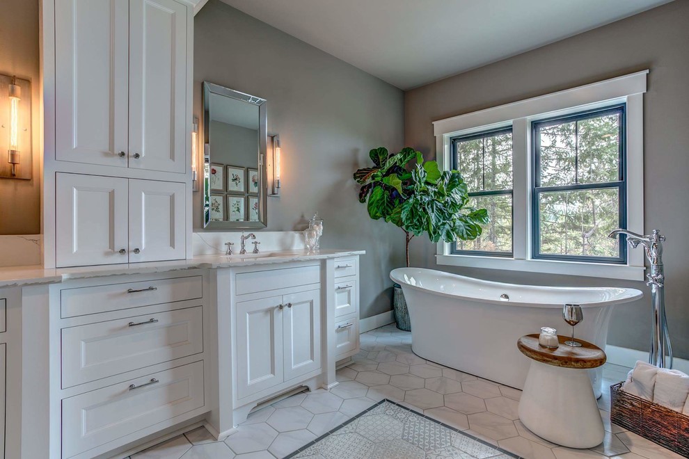 Large country master white tile and ceramic tile ceramic tile and white floor bathroom photo in Other with recessed-panel cabinets, white cabinets, a one-piece toilet, gray walls, an undermount sink, quartz countertops and a hinged shower door