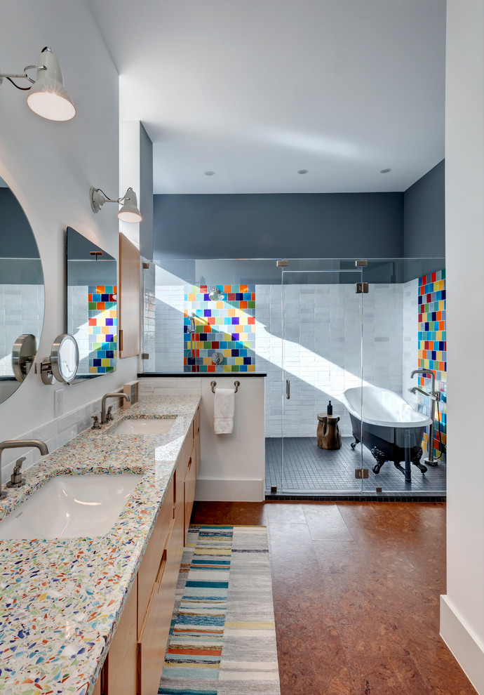 Photo of an eclectic ensuite wet room bathroom in Austin with medium wood cabinets, multi-coloured tiles, cork flooring, brown floors, flat-panel cabinets, a claw-foot bath, white walls, a submerged sink, a hinged door and multi-coloured worktops.