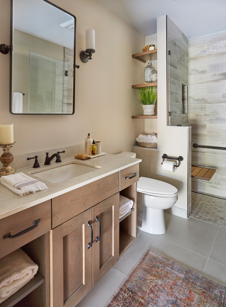 Small arts and crafts 3/4 multicolored tile and porcelain tile porcelain tile and gray floor alcove shower photo in Chicago with shaker cabinets, light wood cabinets, a two-piece toilet, beige walls, an undermount sink, quartz countertops, a hinged shower door and gray countertops
