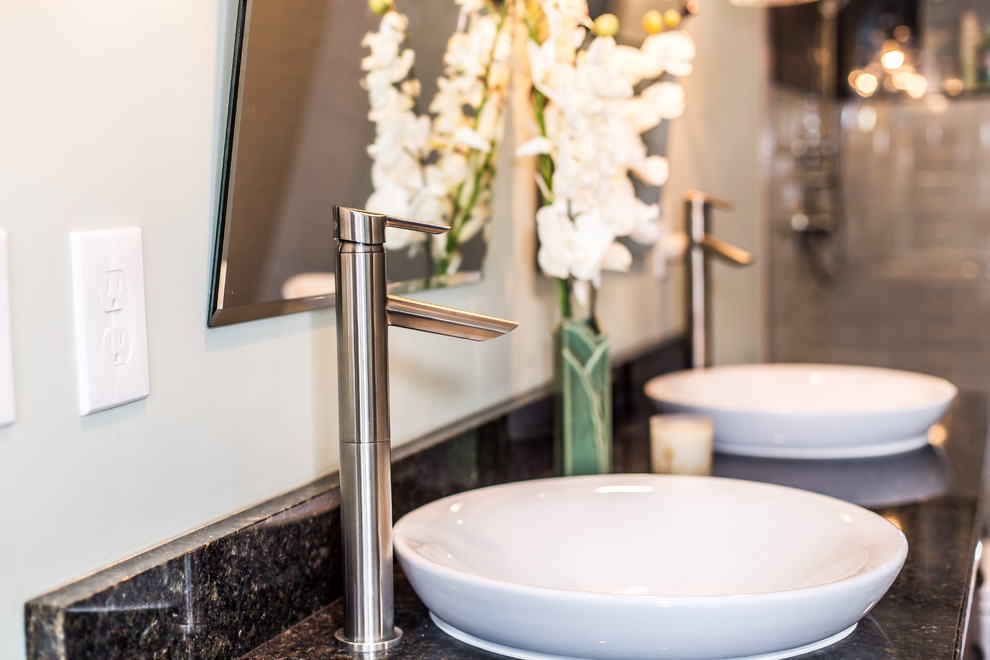 Bathroom - mid-sized transitional 3/4 white tile and ceramic tile vinyl floor and brown floor bathroom idea in Other with furniture-like cabinets, distressed cabinets, gray walls and a vessel sink