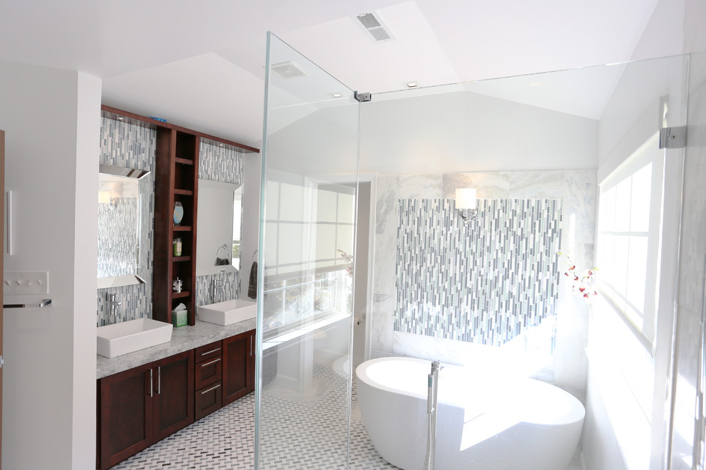 Inspiration for a large contemporary master white tile and glass tile marble floor and multicolored floor bathroom remodel in DC Metro with a vessel sink, shaker cabinets, dark wood cabinets, granite countertops, a one-piece toilet and white walls