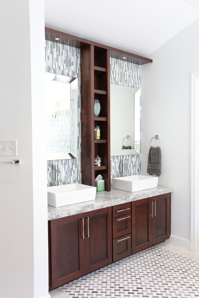Inspiration for a large contemporary ensuite bathroom in DC Metro with a vessel sink, shaker cabinets, dark wood cabinets, granite worktops, a freestanding bath, a double shower, a one-piece toilet, white tiles, glass tiles, white walls and marble flooring.