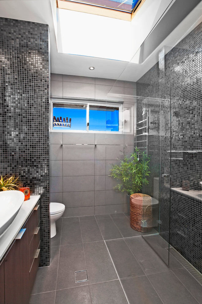 Inspiration for a contemporary black tile and mosaic tile bathroom remodel in San Francisco