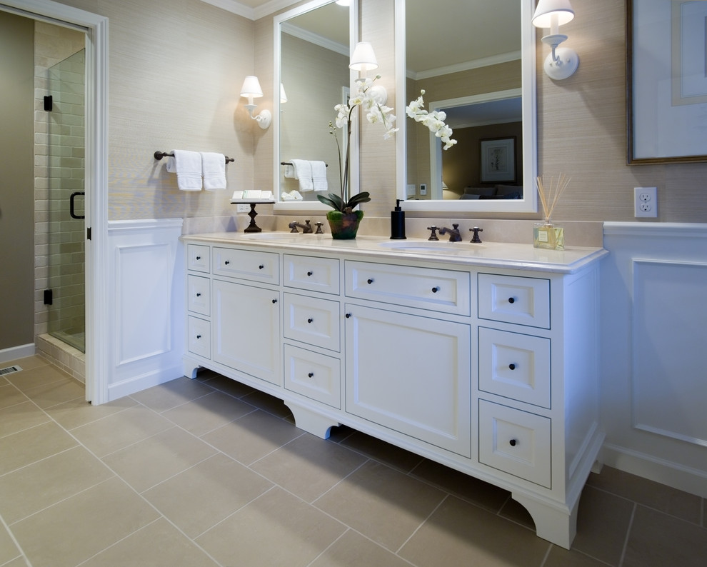Elegant beige tile corner shower photo in Portland with recessed-panel cabinets and white cabinets