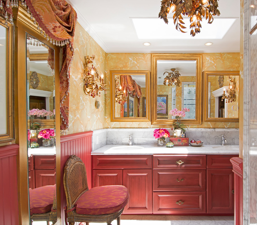 Inspiration for a victorian bathroom remodel in Los Angeles with recessed-panel cabinets, red cabinets, yellow walls and an undermount sink