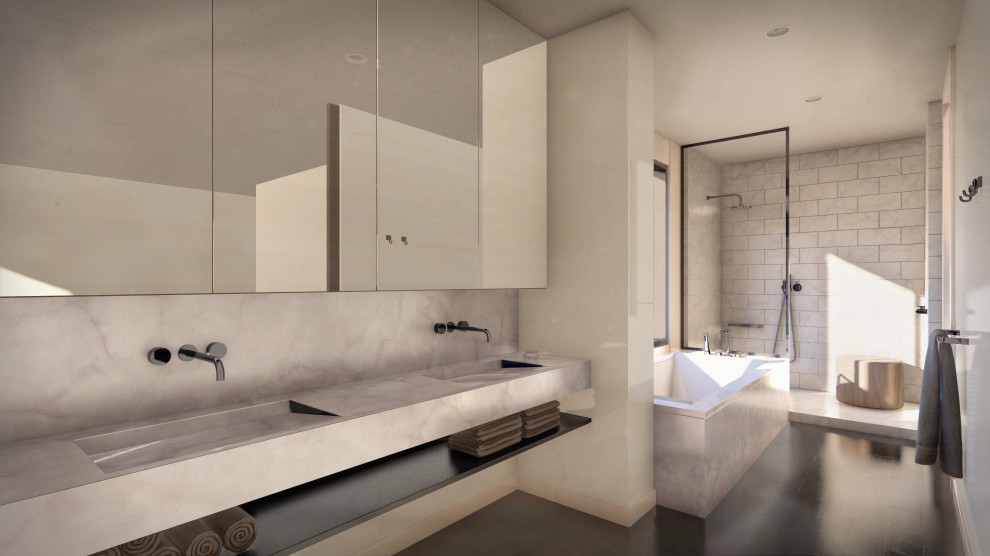 Bild på ett funkis vit vitt en-suite badrum, med ett undermonterat badkar, marmorkakel, vita väggar, ett integrerad handfat, marmorbänkskiva och svart golv