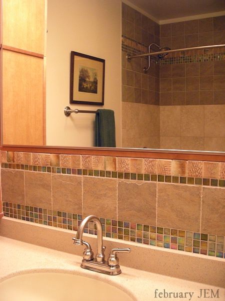 Design ideas for a small contemporary ensuite bathroom in Chicago with recessed-panel cabinets, light wood cabinets, a shower/bath combination, green tiles, mosaic tiles, an integrated sink, solid surface worktops, a shower curtain and beige worktops.