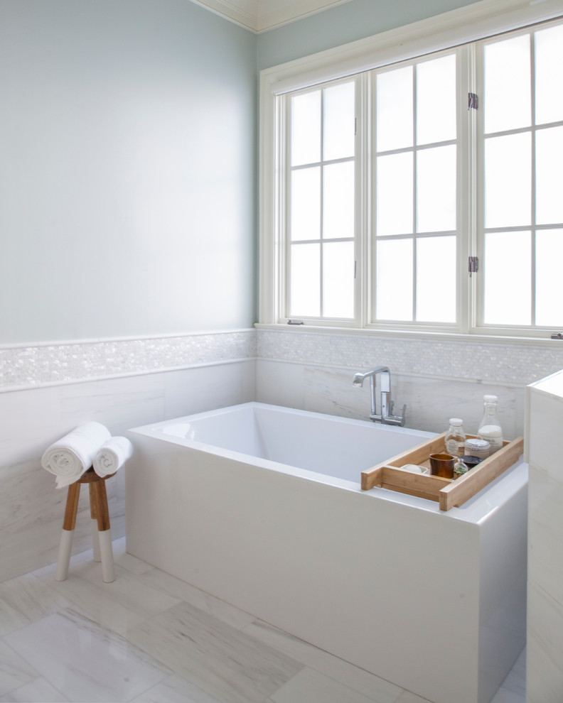 Freestanding bathtub - mid-sized transitional master marble floor and white floor freestanding bathtub idea in Charlotte with an undermount sink, white cabinets and blue walls